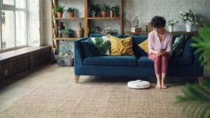 Peaceful mom relaxing in clean bright home